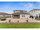 A spacious backyard with a brick patio, outdoor seating, and well-maintained landscaping offers a relaxing outdoor retreat at 4622 Fairy Tale Cir, Kissimmee, FL 34746