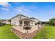 Backyard with patio and lawn at 4622 Fairy Tale Cir, Kissimmee, FL 34746