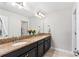 Bathroom featuring double sink vanity with granite countertops at 4622 Fairy Tale Cir, Kissimmee, FL 34746