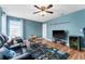 Bright bedroom featuring ceiling fan, Star Wars rug, and an entertainment center at 4622 Fairy Tale Cir, Kissimmee, FL 34746