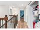Hallway upstairs with wood floors and access to rooms at 4622 Fairy Tale Cir, Kissimmee, FL 34746