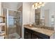 The main bathroom has a stand up shower, granite countertop and updated fixtures at 4622 Fairy Tale Cir, Kissimmee, FL 34746