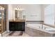 The main bathroom includes a soaking tub, granite countertops, and updated fixtures at 4622 Fairy Tale Cir, Kissimmee, FL 34746