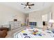 The airy main bedroom features a ceiling fan, windows, and access to the Primary bathroom at 4622 Fairy Tale Cir, Kissimmee, FL 34746