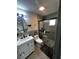 Bathroom featuring a white vanity, tiled walls, and a glass shower at 4706 Kimball W Ct, Lakeland, FL 33813