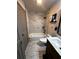 Modern bathroom with a shower and a tub with marble tile at 4706 Kimball W Ct, Lakeland, FL 33813