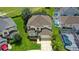 Aerial view of home with a large lot, swimming pool, and a two-car garage at 523 Higher Combe Dr, Davenport, FL 33897