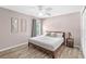 Bedroom featuring wood floors, ceiling fan, one window, and art on the walls at 523 Higher Combe Dr, Davenport, FL 33897