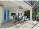 Screened lanai with tile flooring, ceiling fan, and outdoor dining set offers a serene space for relaxation at 523 Higher Combe Dr, Davenport, FL 33897