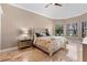 Bright bedroom featuring a large bed, neutral tones, and an abundance of natural light from windows at 5524 Sail Ct, Orlando, FL 32819