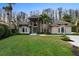 Stunning two-story home with stone accents, manicured lawn, and lush landscaping at 5524 Sail Ct, Orlando, FL 32819