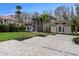 Beautiful home with stone accents, manicured lawn, and spacious paver driveway at 5524 Sail Ct, Orlando, FL 32819