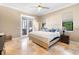 Bright main bedroom with large window and access to outdoor kitchen at 5524 Sail Ct, Orlando, FL 32819