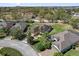 Aerial view of a home with well-maintained landscaping on a large lot in a neighborhood at 556 Grande Dr, Davenport, FL 33837