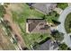 Aerial view of house with well-manicured lawn and landscaping at 556 Grande Dr, Davenport, FL 33837