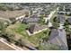 Aerial view of a house with a spacious lawn in a neighborhood at 556 Grande Dr, Davenport, FL 33837