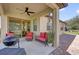 Covered patio with ceiling fan, outdoor furniture, grill, and a view of the backyard at 556 Grande Dr, Davenport, FL 33837