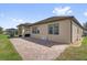 Paver patio and walkway along the rear of the house at 556 Grande Dr, Davenport, FL 33837