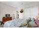 View of the Primary bedroom with TV, dresser, and closet, that is decorated with neutral colors at 556 Grande Dr, Davenport, FL 33837