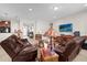 Open concept living room showcasing tile floors, neutral tones, and seamless flow to other living areas at 556 Grande Dr, Davenport, FL 33837