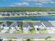 Aerial view of a home with a water view; includes neighborhood, property line and nearby trees at 585 Mosaic Blvd, Daytona Beach, FL 32124