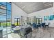 Open community center with tables, chairs, and comfortable lounge seating at 585 Mosaic Blvd, Daytona Beach, FL 32124