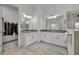 Spacious bathroom with double vanities, framed mirrors, and glass-enclosed shower promotes a luxurious feel at 585 Mosaic Blvd, Daytona Beach, FL 32124