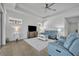 Comfortable living room with ceiling fan and view of outdoor patio at 585 Mosaic Blvd, Daytona Beach, FL 32124