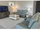 The well-lit living room offers cozy seating and a calm atmosphere, perfect for relaxation at 585 Mosaic Blvd, Daytona Beach, FL 32124