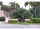 Entrance sign surrounded by lush tropical foliage leading into the neighborhood at 592 Orange Dr # 140, Altamonte Springs, FL 32701