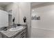 Clean bathroom featuring a vanity with granite countertop and a large mirror at 650 Peyton Brooke Way, Winter Haven, FL 33881