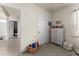 Neutral bedroom with plush carpet, white dresser, and easy access to other rooms at 650 Peyton Brooke Way, Winter Haven, FL 33881