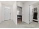 Open hallway showcasing tile flooring, leading to the bedroom and bathroom at 650 Peyton Brooke Way, Winter Haven, FL 33881