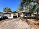 Single-story home with a long driveway and an exterior back porch at 7002 Rose Ave, Orlando, FL 32810