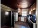 Kitchen area with essential appliances, tile flooring, and a window at 7002 Rose Ave, Orlando, FL 32810