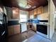 Kitchen area with essential appliances and tile flooring at 7002 Rose Ave, Orlando, FL 32810