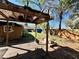 Backyard pergola with deck features a covered outdoor space at 7002 Rose Ave, Orlando, FL 32810