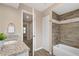 Bathroom featuring a vanity with granite countertops, a shower, and a bathtub at 7037 Edgeworth Dr, Orlando, FL 32819