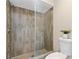 Tiled walk-in shower with glass door in the bathroom at 7037 Edgeworth Dr, Orlando, FL 32819