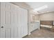 Bathroom featuring a vanity with granite countertops, a soaking tub, and a skylight at 7037 Edgeworth Dr, Orlando, FL 32819