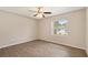 Bedroom featuring wood-look flooring, a ceiling fan, and a window at 7037 Edgeworth Dr, Orlando, FL 32819