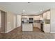 Well-lit kitchen with stainless steel appliances and granite countertops, in open-concept space at 7037 Edgeworth Dr, Orlando, FL 32819