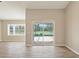 Bright living room with tile floors and view of the pool at 7037 Edgeworth Dr, Orlando, FL 32819