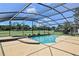 Inviting screened-in pool area with a spa, perfect for enjoying the outdoors and golf course views at 7037 Edgeworth Dr, Orlando, FL 32819