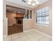 Charming dining room with tile floors, ample natural light, and view into the living area at 7215 Scenic Pl, Lakeland, FL 33810