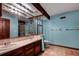 Unique bathroom with dual sinks, tiled floors, and decorative wood accents at 7252 June Bug Ln, Orlando, FL 32818