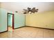 Comfortable bedroom with tile floors, a ceiling fan, and light-filled doorway at 7252 June Bug Ln, Orlando, FL 32818