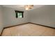 Cozy bedroom featuring neutral tile flooring and a modern ceiling fan at 7252 June Bug Ln, Orlando, FL 32818