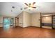 Spacious living room with French doors, tile flooring, and natural light at 7252 June Bug Ln, Orlando, FL 32818