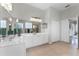 Bright bathroom featuring dual sinks, vanity with storage, and a large mirror at 739 Spring Island Way, Orlando, FL 32828